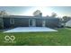 Spacious backyard with a large patio and lush green lawn perfect for outdoor activities at 865 Countryside Ln, Columbus, IN 47201