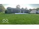 Expansive backyard featuring a large patio and lush green lawn, ideal for entertaining at 865 Countryside Ln, Columbus, IN 47201