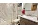 Bathroom with shower, toilet, vanity, and mirror at 865 Countryside Ln, Columbus, IN 47201