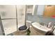 Bathroom with a shower, toilet, sink, cabinet, and blue walls at 865 Countryside Ln, Columbus, IN 47201