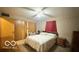 Cozy bedroom with neutral tones, ample closet space, and natural light at 865 Countryside Ln, Columbus, IN 47201