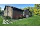 This home features a well-manicured lawn and attractive combination of stone and wood siding at 865 Countryside Ln, Columbus, IN 47201