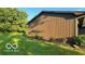 This home features a well-manicured lawn and attractive combination of stone and wood siding at 865 Countryside Ln, Columbus, IN 47201