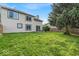 A spacious backyard with a well-kept lawn and a classic wood fence offers privacy and a touch of nature at 8908 Sunningdale Blvd, Indianapolis, IN 46234