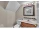 Cozy bathroom with framed mirror, modern vanity and great lighting at 8908 Sunningdale Blvd, Indianapolis, IN 46234