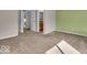 Bedroom featuring carpet, neutral paint, and a large closet at 8908 Sunningdale Blvd, Indianapolis, IN 46234