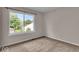 Bedroom featuring large window letting in lots of natural light and neutral carpeting at 8908 Sunningdale Blvd, Indianapolis, IN 46234