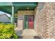 Covered front porch showing the home's brick facade and red front door at 8908 Sunningdale Blvd, Indianapolis, IN 46234