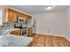 Well-lit kitchen with stainless steel appliances, granite countertops and wood-look flooring at 8908 Sunningdale Blvd, Indianapolis, IN 46234