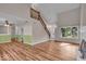 Open-concept living room featuring hardwood floors, fireplace, and lots of natural light at 8908 Sunningdale Blvd, Indianapolis, IN 46234