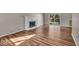Spacious living room boasts hardwood floors and a fireplace for a cozy feel at 8908 Sunningdale Blvd, Indianapolis, IN 46234