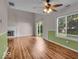 Spacious living room featuring wood-look floors, updated paint, fireplace and patio access at 8908 Sunningdale Blvd, Indianapolis, IN 46234