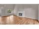 Bright living room features a cozy fireplace, hardwood floors, and natural light at 8908 Sunningdale Blvd, Indianapolis, IN 46234