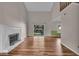 Open-concept living room with high ceilings, fireplace, and sliding glass doors at 8908 Sunningdale Blvd, Indianapolis, IN 46234