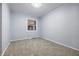 Bedroom showcasing neutral carpet, a window, and light gray walls at 903 Sunset Dr, Lebanon, IN 46052