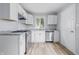 A modern, updated kitchen features white cabinets, stainless steel appliances, and stylish countertops at 903 Sunset Dr, Lebanon, IN 46052