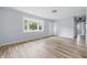 The living room features new flooring, a bay window, and plenty of natural light at 903 Sunset Dr, Lebanon, IN 46052