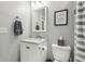 Bright bathroom features a marble vanity, a framed mirror, and gray towels, offering a fresh and inviting space at 923 42Nd St, Indianapolis, IN 46205