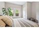 Bright bedroom features a comfortable bed and plenty of natural light at 923 42Nd St, Indianapolis, IN 46205