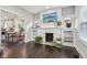 Bright living room features painted fireplace and open access to the dining area at 923 42Nd St, Indianapolis, IN 46205