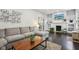 Open-concept living room showing dark wood floors, large sectional, and fireplace at 923 42Nd St, Indianapolis, IN 46205