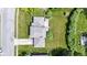 Birds-eye view of home displaying a large yard, driveway, landscaping and surrounding neighborhood at 10502 E Lakeshore Dr, Carmel, IN 46033