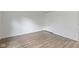 A well-lit bedroom featuring modern floors and closet at 10502 E Lakeshore Dr, Carmel, IN 46033