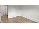 Bright bedroom showcasing modern wood-look floors and neutral wall colors at 10502 E Lakeshore Dr, Carmel, IN 46033