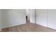 Bedroom offers wood-look floors and convenient closet access at 10502 E Lakeshore Dr, Carmel, IN 46033