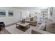 Bright and airy living room open to kitchen with bar seating at 10502 E Lakeshore Dr, Carmel, IN 46033