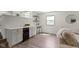 Living area boasts a wine fridge, bar area, and natural light at 10502 E Lakeshore Dr, Carmel, IN 46033