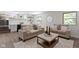 Open concept living area with view of the kitchen and stairs at 10502 E Lakeshore Dr, Carmel, IN 46033
