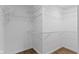 Spacious walk-in closet with adjustable wire shelving for optimal storage solutions and organization at 10502 E Lakeshore Dr, Carmel, IN 46033