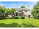 Home's exterior with screened porch and patio, complemented by a spacious and well-maintained lawn at 10965 Fairway Ridge Ln, Fishers, IN 46037