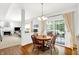Cozy dining area with views to the backyard and living room, with hardwood floors at 10965 Fairway Ridge Ln, Fishers, IN 46037