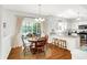 Cozy dining area with access to the backyard and views to the well-equipped kitchen at 10965 Fairway Ridge Ln, Fishers, IN 46037