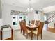 Bright dining room with large windows, stylish valance, and a wooden dining set at 10965 Fairway Ridge Ln, Fishers, IN 46037