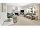 Inviting living room featuring a fireplace, comfortable seating, and lots of natural light at 10965 Fairway Ridge Ln, Fishers, IN 46037