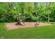 Community playground features a slide, climbing structure, and swings at 10965 Fairway Ridge Ln, Fishers, IN 46037