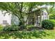 Outdoor living space with a screened-in porch and well maintained landscaping at 10965 Fairway Ridge Ln, Fishers, IN 46037