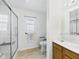 Bright bathroom with a walk-in shower, safety features, and neutral decor at 1108 Northfield Ln, Anderson, IN 46011