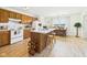 Inviting kitchen with a center island, wood cabinets, and adjacent dining area at 1108 Northfield Ln, Anderson, IN 46011