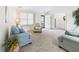 Bright and airy living room with plush carpet, comfortable seating, and natural light at 1108 Northfield Ln, Anderson, IN 46011