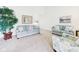 Bright living room with plush carpeting, neutral walls, and comfortable seating arrangement at 1108 Northfield Ln, Anderson, IN 46011