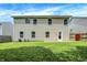 Spacious backyard featuring a well-maintained lawn and access to the house with mature shade trees at 11437 High Grass Dr, Indianapolis, IN 46235