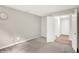 Bright bedroom featuring neutral walls, soft carpet, and doorway leading to other spaces at 11437 High Grass Dr, Indianapolis, IN 46235