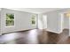 Hardwood bedroom with two bright windows offering natural light and inviting outdoor views at 11437 High Grass Dr, Indianapolis, IN 46235