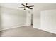 Bedroom featuring neutral carpet, ceiling fan and white closet doors at 11437 High Grass Dr, Indianapolis, IN 46235