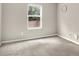 A simple bedroom with natural light and a view of the backyard through the window at 11437 High Grass Dr, Indianapolis, IN 46235