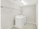 Laundry room featuring washer, dryer and a wire shelf at 11437 High Grass Dr, Indianapolis, IN 46235